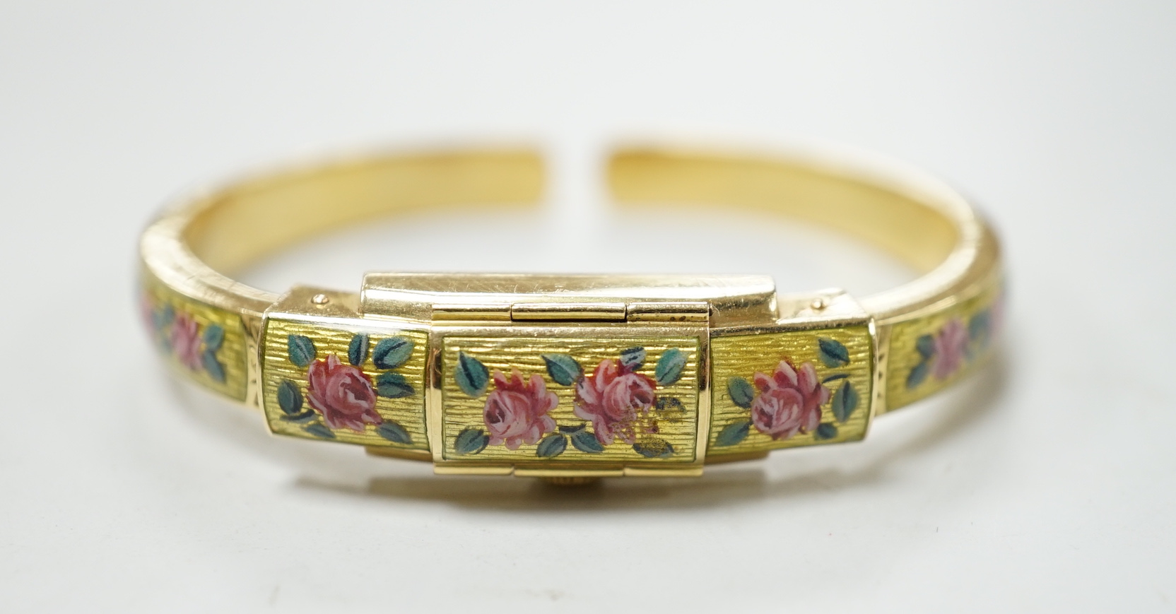 A lady's 750 and enamel Golay Stahl manual wind bangle watch, interior diameter 48mm, gross weight 22.6 grams.